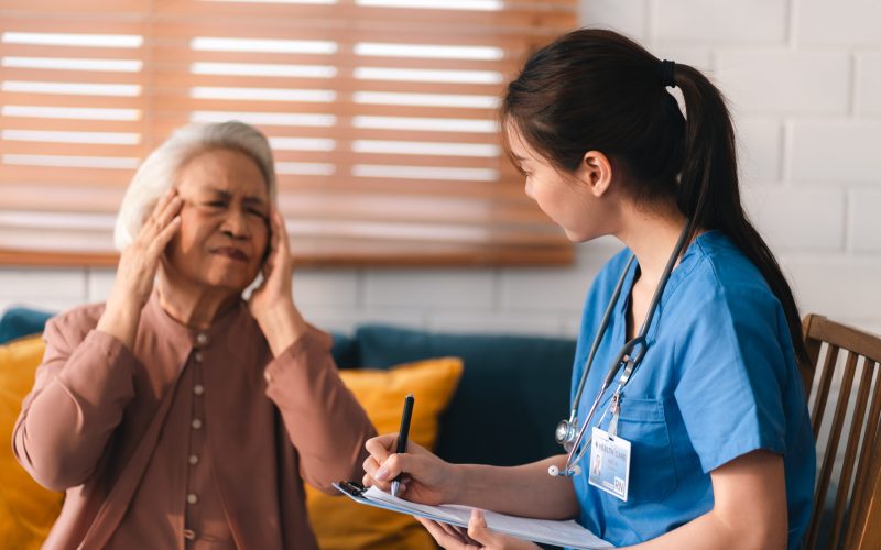 Young asian woman or nurse care hand on senior grandmother shoulder give support empathy to elderly lady or older people in assisted care mental health sick relief concept hand clasp to encourage